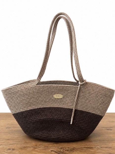 ViBo handwoven rope tote bag in the Sand & Espresso colorway, showing coiled rope stitching and brass nameplate detail